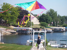 Boy playing with kite alone since you have back pain